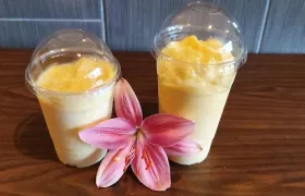 A fresh fruit smoothie made at Pada Thai, garnished with a tropical flower